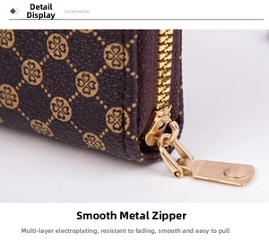 Macro shot of smooth gold-tone zipper on brown monogram check mini coin purse