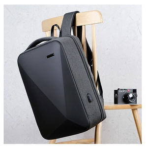 Detail of hardshell business laptop backpack with geometric design and USB charging port