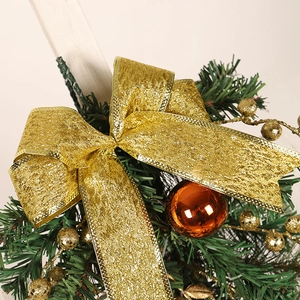 Golden Christmas bow hanging decoration with pine needles and glittery baubles ornament