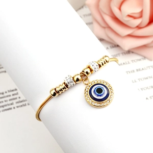 Adjustable golden stainless steel snake chain bracelet with blue evil eye charm