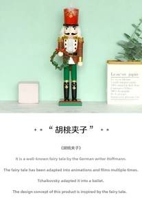 Close-up of 38cm wooden Nutcracker soldier holding a festive green Christmas wreath