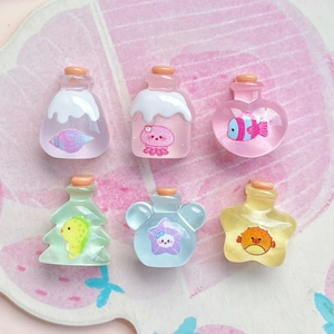 Mini transparent ocean wishing bottles with colorful marine charms and cork stoppers