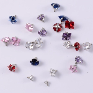 Macro detail of assorted heart and star shaped zircon stud heads in vibrant colors