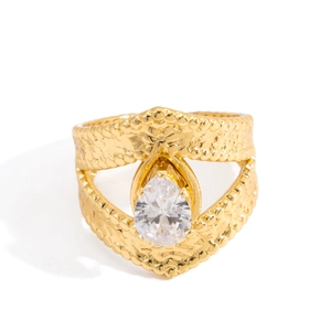 Close-up of 18K gold stainless steel ring with hammered texture and drop-cut zircon