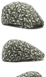 Detailed multi-angle view of a vintage beret cap with black and white abstract stone pattern