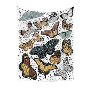 Detailed view of bohemian butterfly tapestry with vibrant wings and starry white background