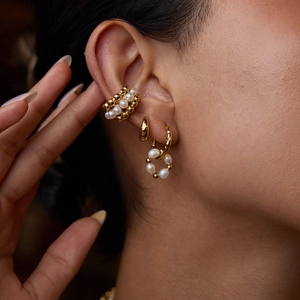 Luxury 18K gold-plated stainless steel pearl earrings and ear cuff set on female model