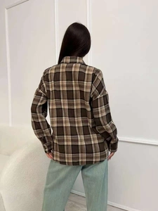 Women's vintage plaid shirt in brown flannel with a relaxed fit and long sleeves