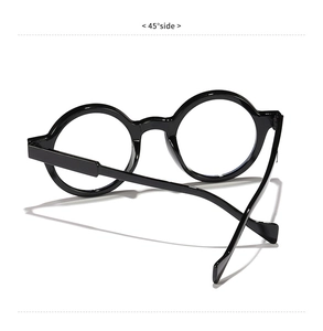 Detail view of black round vintage frame glasses showing 45-degree side angle and hinges