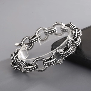 Detail of vintage silver titanium steel chain bracelet with textured O-ring links