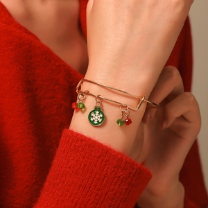 Detail of adjustable Christmas bracelet with snowflake pendant and beads on wrist