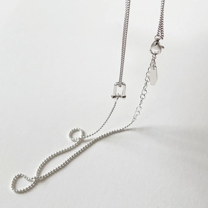 Detail of 925 sterling silver U-buckle necklace with bead chain and lobster clasp