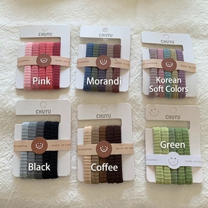 6 sets of ribbed elastic hair ties in assorted Morandi colors on cardboard display
