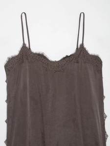 Detail of silk satin camisole with brown lace trim and delicate eyelash floral borders