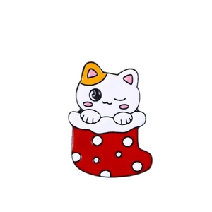 Cute cartoon white cat in a red Christmas stocking enamel pin badge for holiday decor