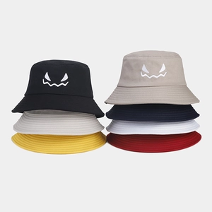 Halloween bucket hats with embroidered ghost face design in multiple colors cotton fabric