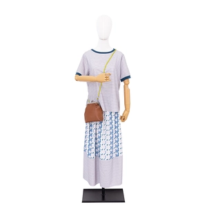 Summer casual 3-piece set with striped T-shirt, floral maxi skirt and brown crossbody bag