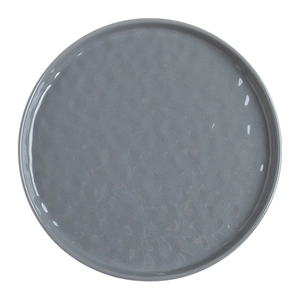 Gray ceramic dinner plate with hammered texture and French minimalist style in overhead view