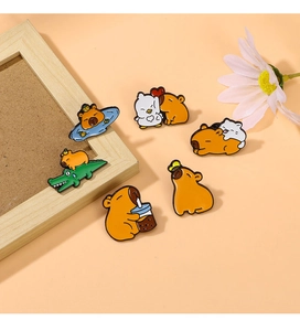 Close-up of cute cartoon Capybara enamel pins set featuring diverse funny animal poses