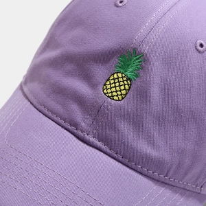 Purple cotton baseball cap with detailed yellow pineapple embroidery on the front