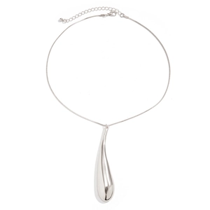Detailed view of a silver teardrop pendant with a polished metallic mirror finish
