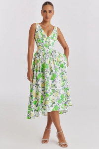 Detailed view of white sleeveless floral midi dress with V-neckline and belted waistline