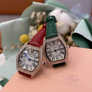 Detail of luxury tonneau quartz watches with diamond bezels and crocodile leather straps