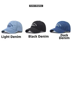 Close-up of three washed denim baseball caps with NYC embroidery in multiple colors