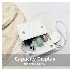Internal view of a white quilted shoulder bag showing capacity for phone and accessories