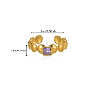 Detail view of gold beaded ring with square purple zircon and dimension markings