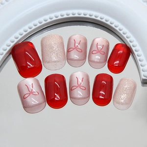 Red bow cat eye press on nails with glitter and jelly red finish in 10 piece set
