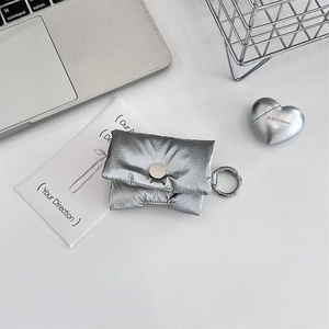 Silver quilted down-style headphone case with metal button and circular carry hook