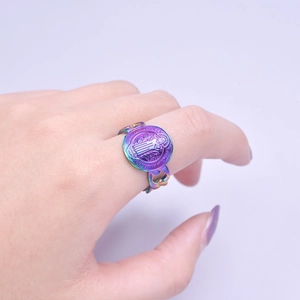Detailed close-up of rainbow saint benedict medal ring with a unique flat chain band