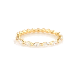 Detailed close-up of gold eternity ring with marquise-cut marquise stones in full pavé