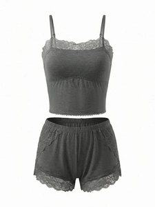 Detailed close-up of dark grey lace-trimmed camisole and matching shorts lounge set