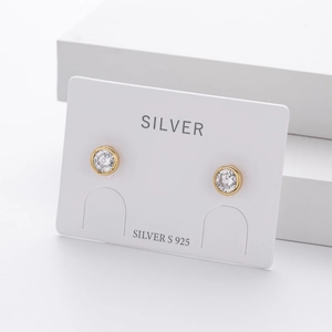 Close-up of S925 sterling silver gold plated round zircon stud earrings on display