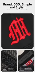 Detail view of red 3D embroidery on a black mesh trucker cap with adjustable strap