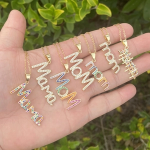 Gold plated copper necklaces with MAMA and MOM pendants featuring colorful cubic zirconia