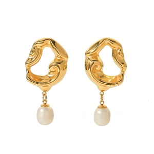 Detail of 18K gold plated lava texture earrings with hanging freshwater pearl pendants