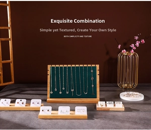Detail of bamboo wood jewelry stand with 11 necklace slots and velvet earring displays