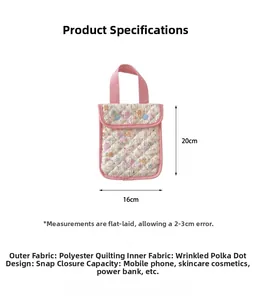 Detailed view of pink quilted handbag with cat print and 20x16cm size specifications