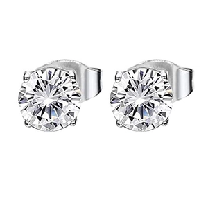 Detailed macro view of classic four-prong silver stud earrings with round cubic zirconia