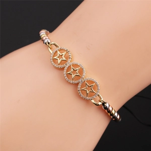 Detail of gold plated star bracelet with tri-color metal beads and pavé diamond rings