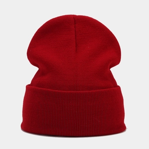 Detailed view of the fine knit texture and wide cuff on a solid red winter beanie hat