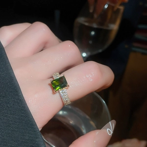 Close-up of 18k gold plated ring featuring a large emerald green zircon stone