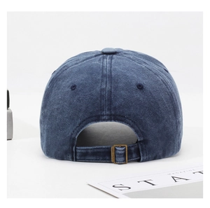 Detail of vintage washed navy cotton baseball cap with adjustable metal back buckle