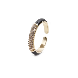 Macro view of adjustable gold and black enamel ring with micro-pave cubic zirconia inlay
