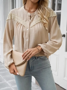 Elegant beige long sleeve blouse with lace shoulder panels and pleated texture fabric