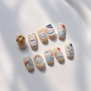 3D embossed press-on nails featuring blue rabbit, sunflowers, and mushroom designs