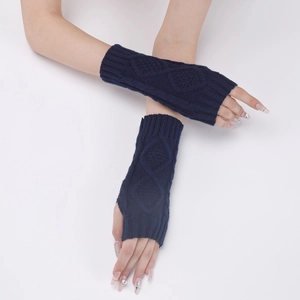 Detail of navy blue cable knit fingerless gloves with soft textured arm warmer design